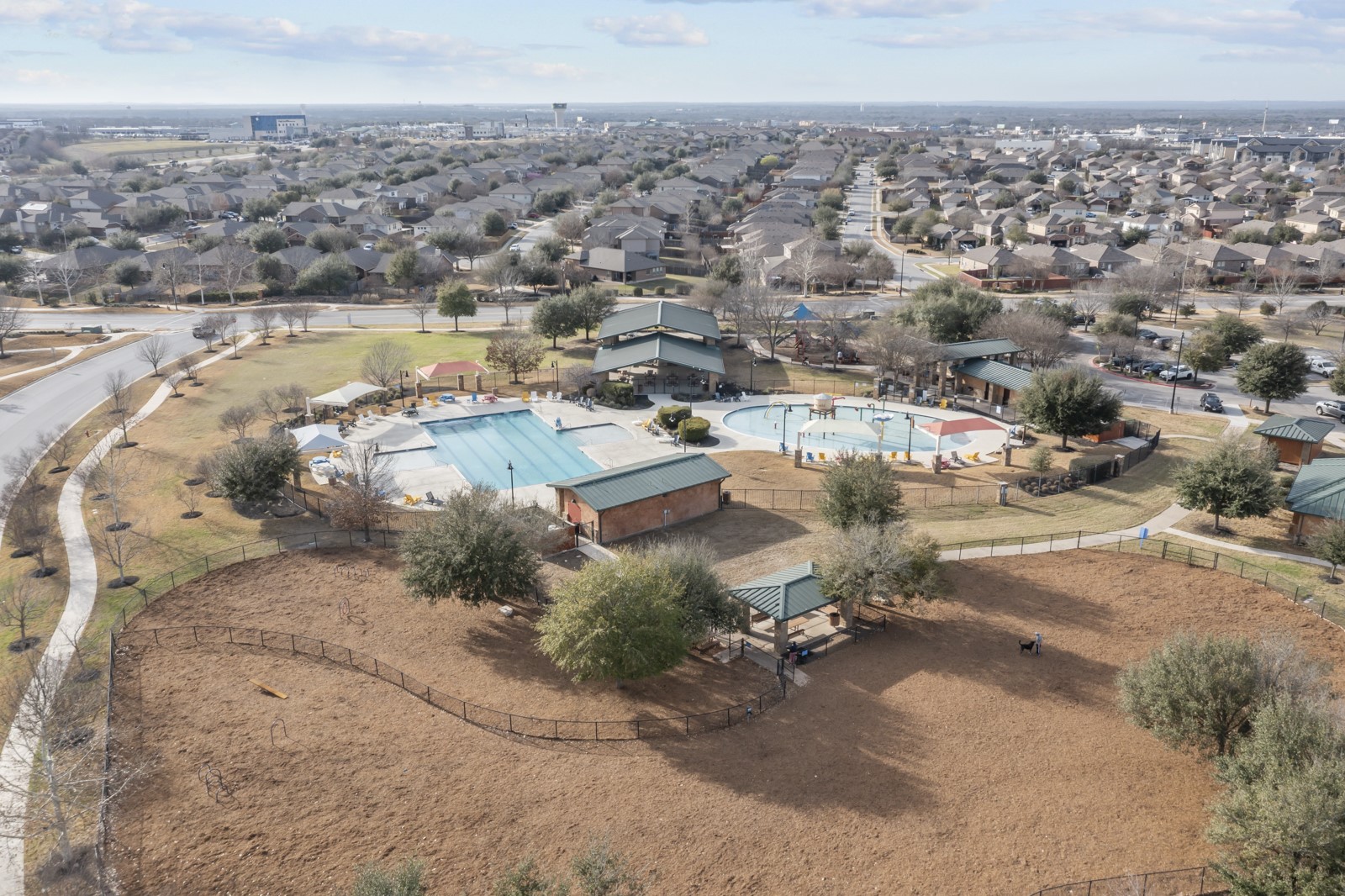245 Razzmatazz Trail Buda, TX 78610 - Photo 39 of 40 Aerial view of residential area with a pool