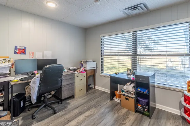 a work room with furniture and a window
