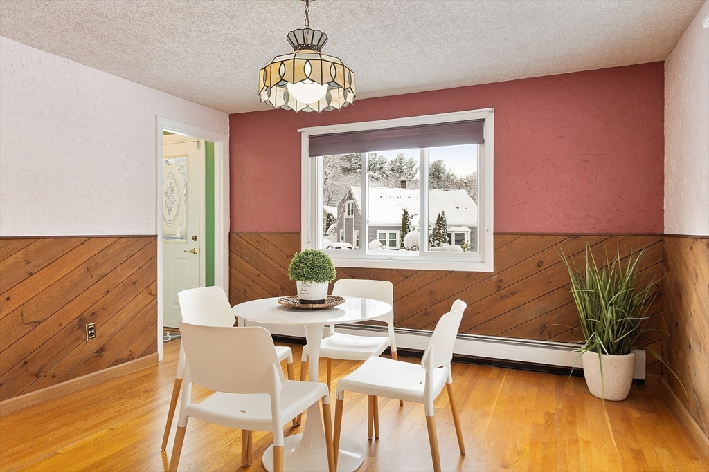 10 Pilling Road Wilmington, MA 01887 - Photo 14 of 41 a view of a dining room with furniture window and wooden floor