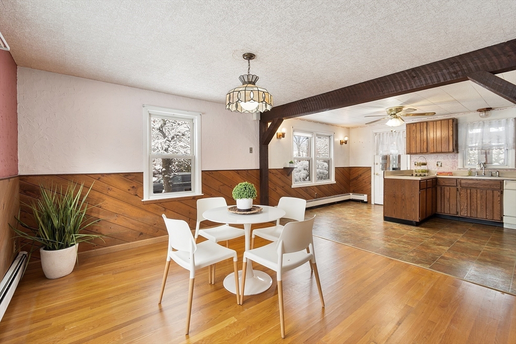 10 Pilling Road Wilmington, MA 01887 - Photo 15 of 41 a view of a dining room with furniture window and wooden floor