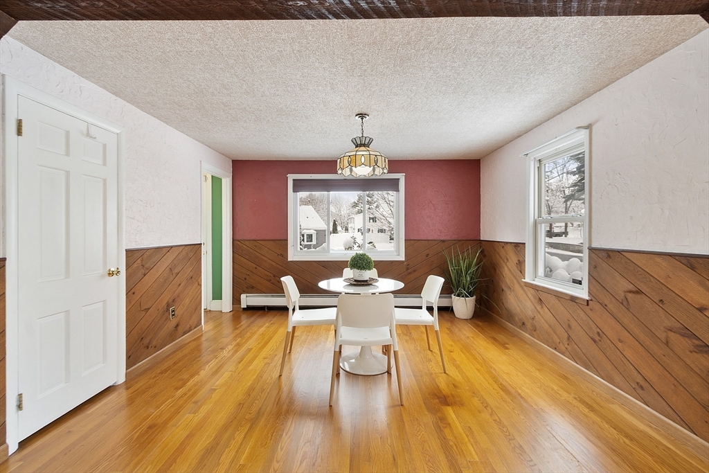 10 Pilling Road Wilmington, MA 01887 - Photo 16 of 41 a view of a dining room with furniture window and wooden floor