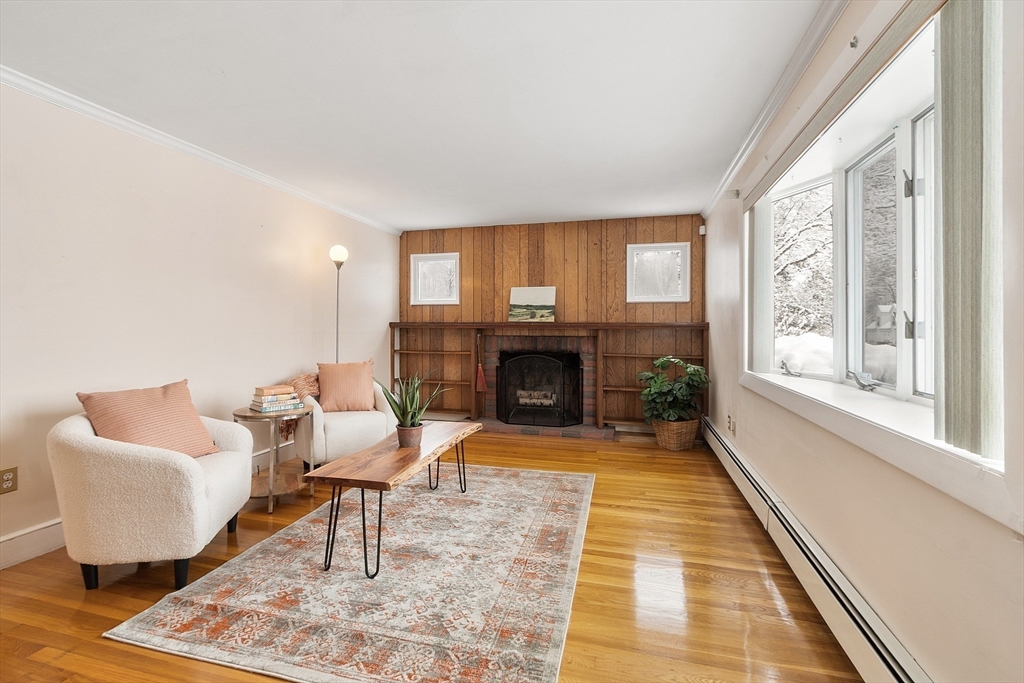 10 Pilling Road Wilmington, MA 01887 - Photo 20 of 41 a living room with furniture and a fireplace