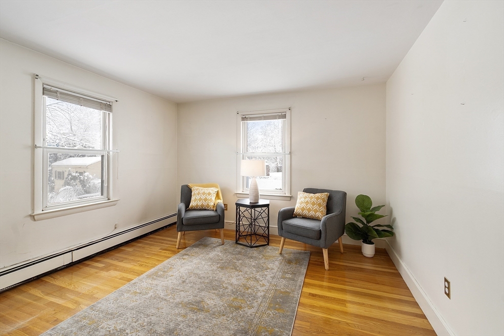 10 Pilling Road Wilmington, MA 01887 - Photo 22 of 41 a living room with furniture and a rug