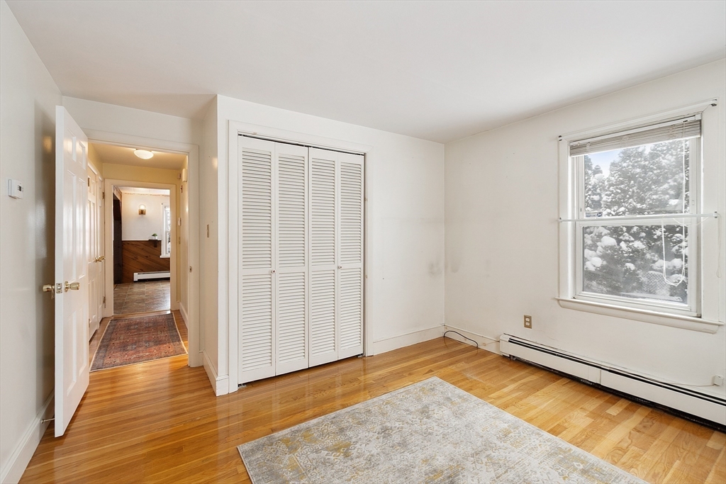 10 Pilling Road Wilmington, MA 01887 - Photo 23 of 41 wooden floor in an empty room with a window