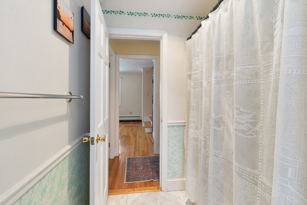 10 Pilling Road Wilmington, MA 01887 - Photo 26 of 41 a bathroom with a shower and a glass door