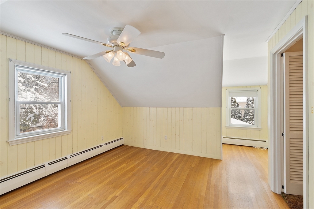 10 Pilling Road Wilmington, MA 01887 - Photo 28 of 41 a view of empty room with wooden floor and fan