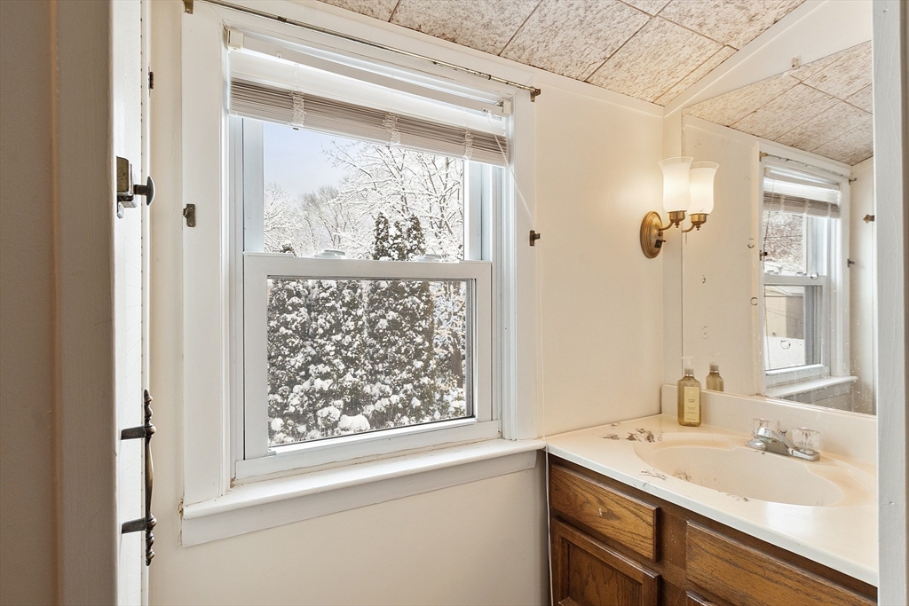 10 Pilling Road Wilmington, MA 01887 - Photo 35 of 41 a bathroom with a sink and a mirror