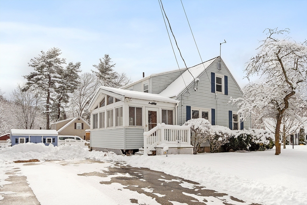 10 Pilling Road Wilmington, MA 01887 - Photo 4 of 41 a front view of a house with a yard covered in snow