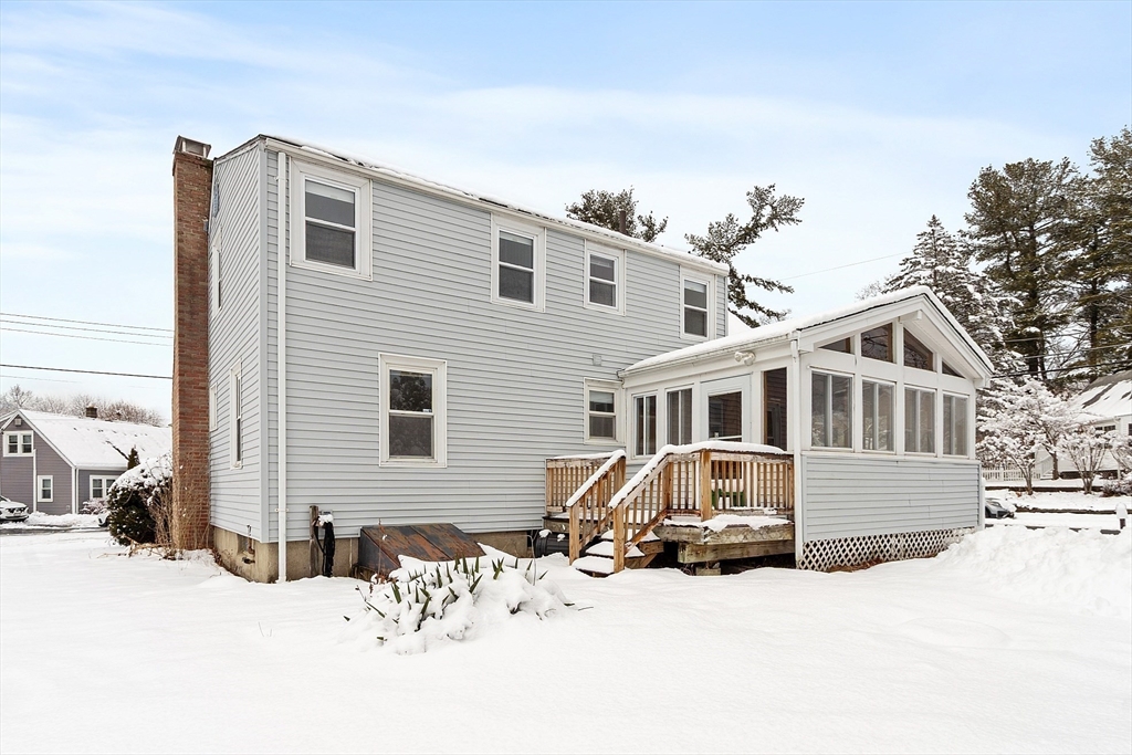 10 Pilling Road Wilmington, MA 01887 - Photo 5 of 41 a front view of a house with a yard covered in snow