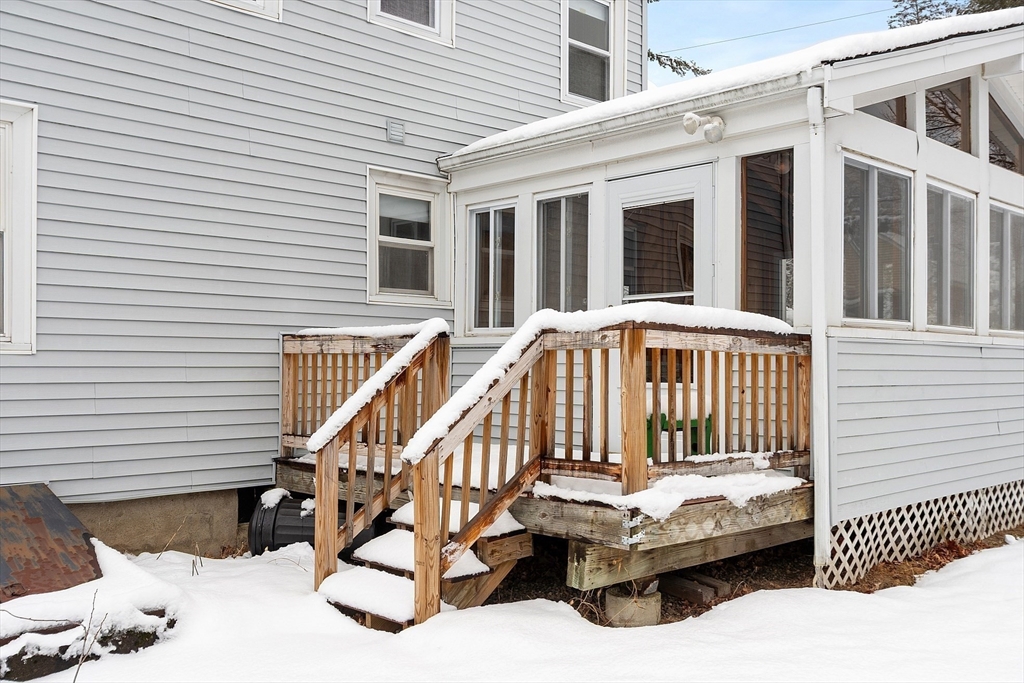 10 Pilling Road Wilmington, MA 01887 - Photo 6 of 41 a view of a patio with a table and chairs