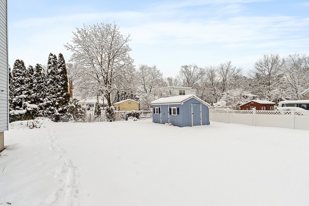 10 Pilling Road Wilmington, MA 01887 - Photo 7 of 41 a street view with large trees