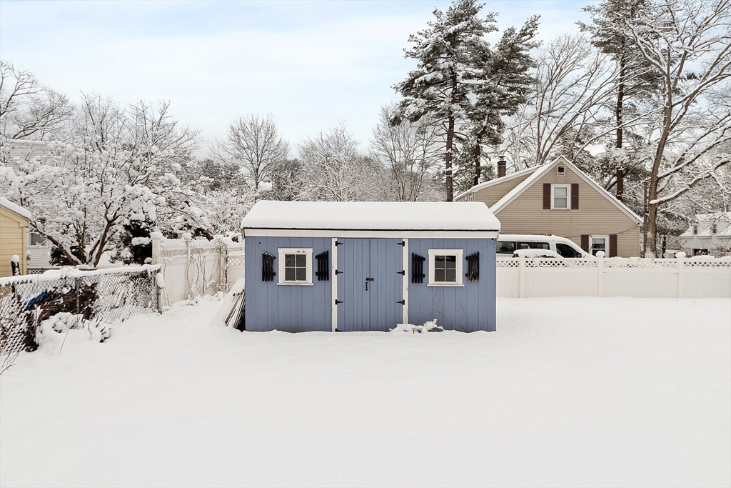 10 Pilling Road Wilmington, MA 01887 - Photo 8 of 41 a front view of a house with a yard and garage