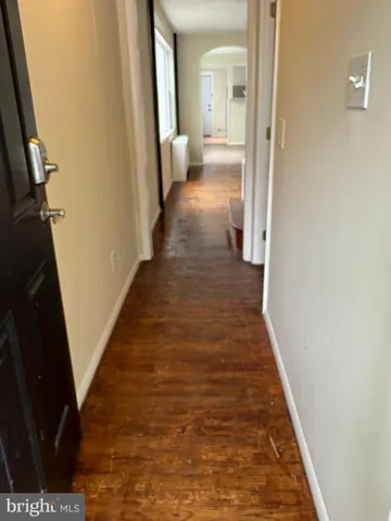 a view of a bathroom from the hallway