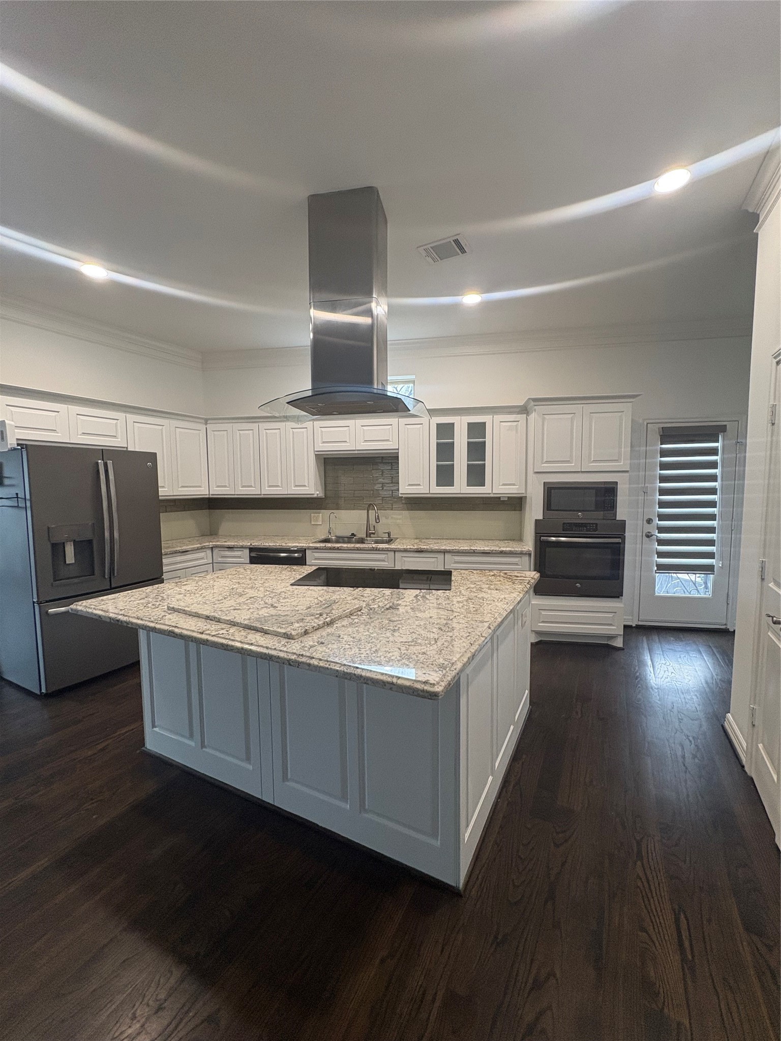 150 Carson Court Houston, TX 77004 - Photo 3 of 10 a kitchen with stainless steel appliances granite countertop a stove and a refrigerator