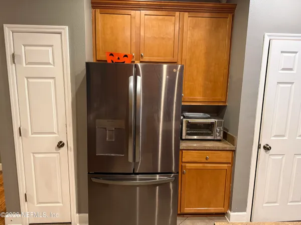 a view of a refrigerator and mirror