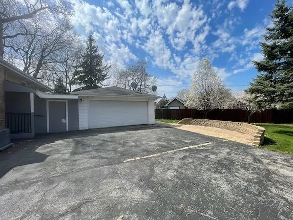 a view of garage and yard
