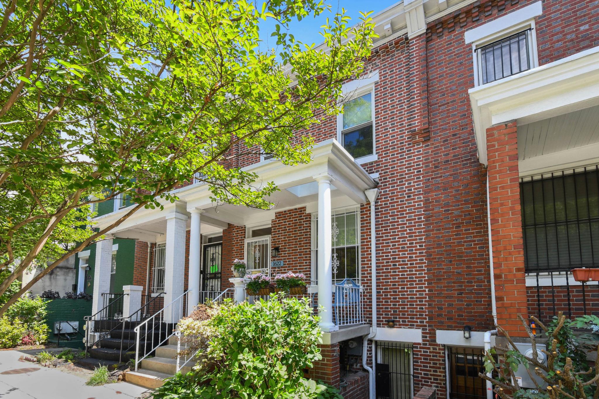1622 Florida Avenue Northwest Washington, DC 20009 - Photo 1 of 34 a front view of a house with a tree