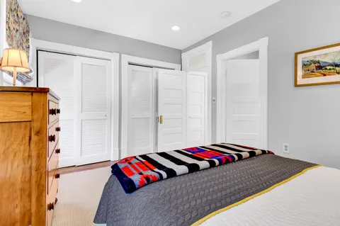 a bedroom with furniture and white walls