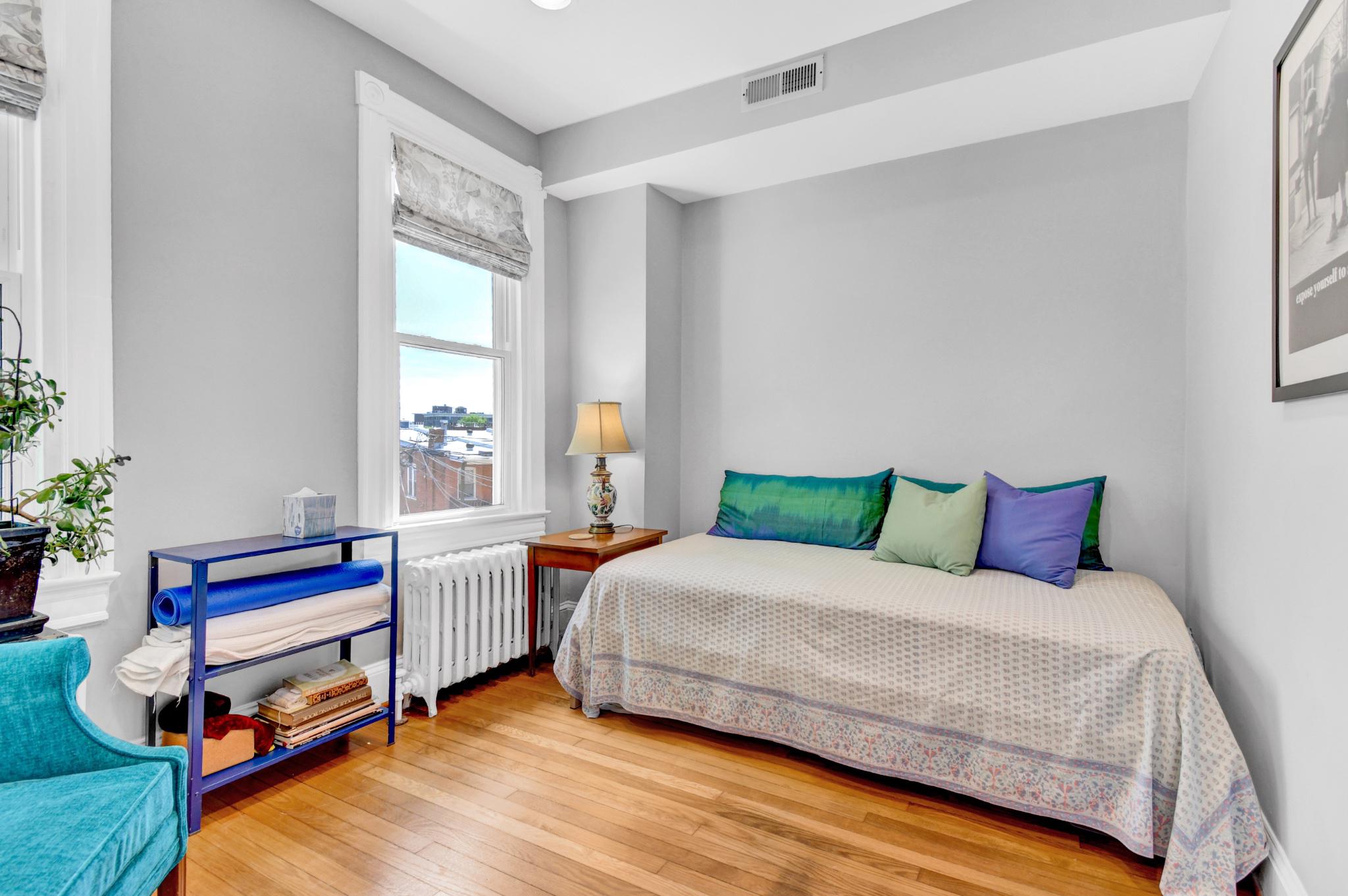 1622 Florida Avenue Northwest Washington, DC 20009 - Photo 22 of 34 a bedroom with a bed and a window