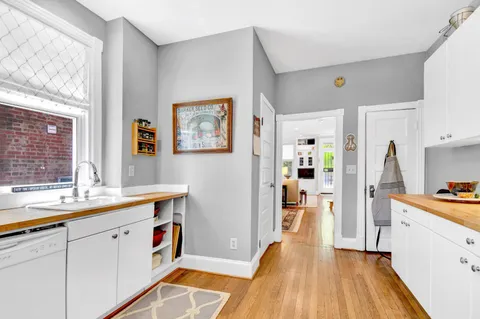 a kitchen with stainless steel appliances a refrigerator and a stove