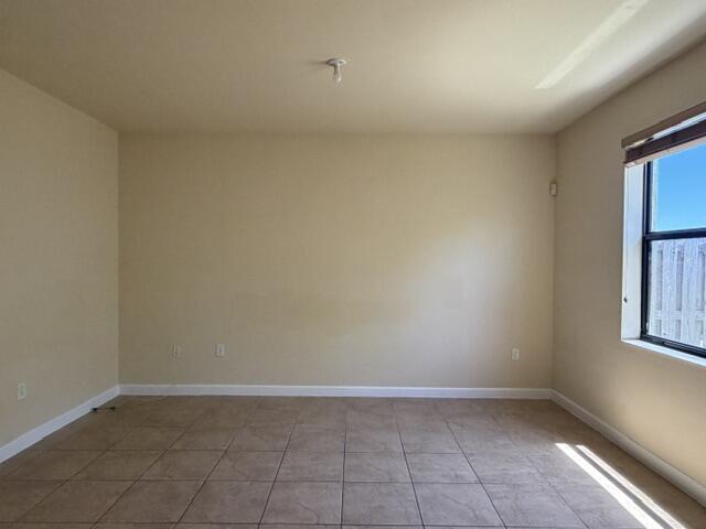 23765 Southwest 118 Avenue, Unit 23765 Homestead, FL 33032 - Photo 7 of 36 a view of an empty room with a window