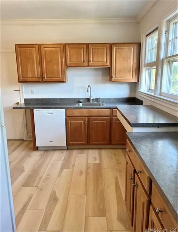 a kitchen with stainless steel appliances granite countertop a sink and a stove