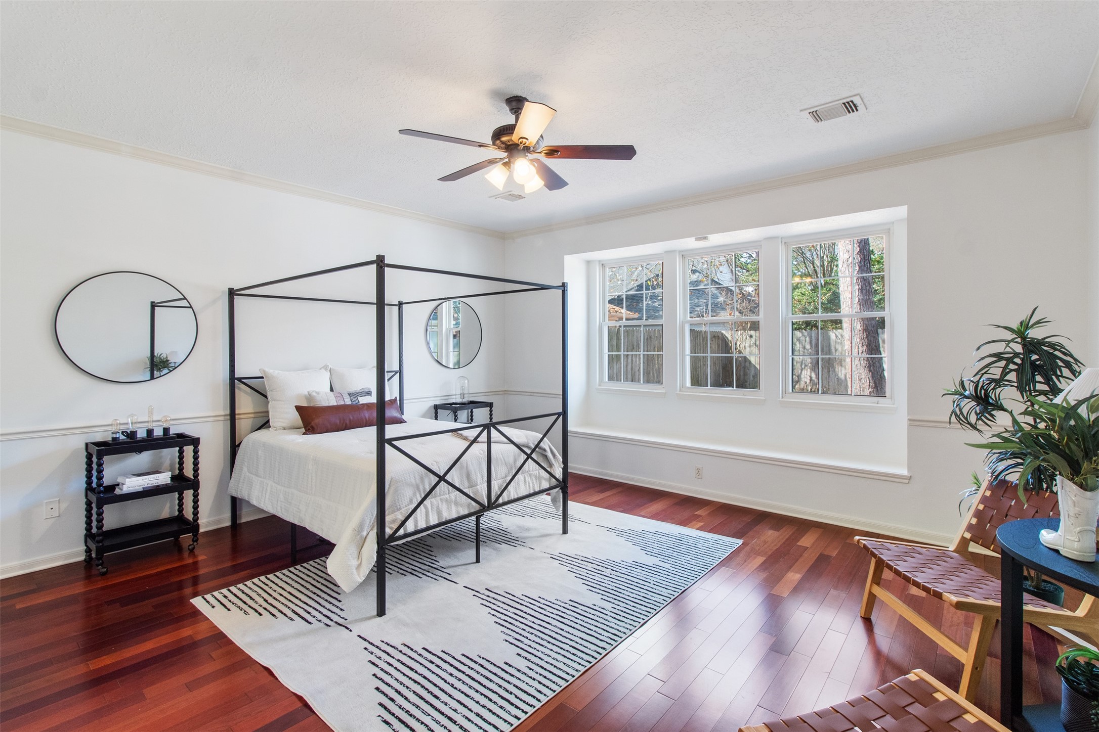 5127 Heathfield Court Houston, TX 77084 - Photo 15 of 37 Rich floors and plenty of bright light welcome you into the spacious primary room.