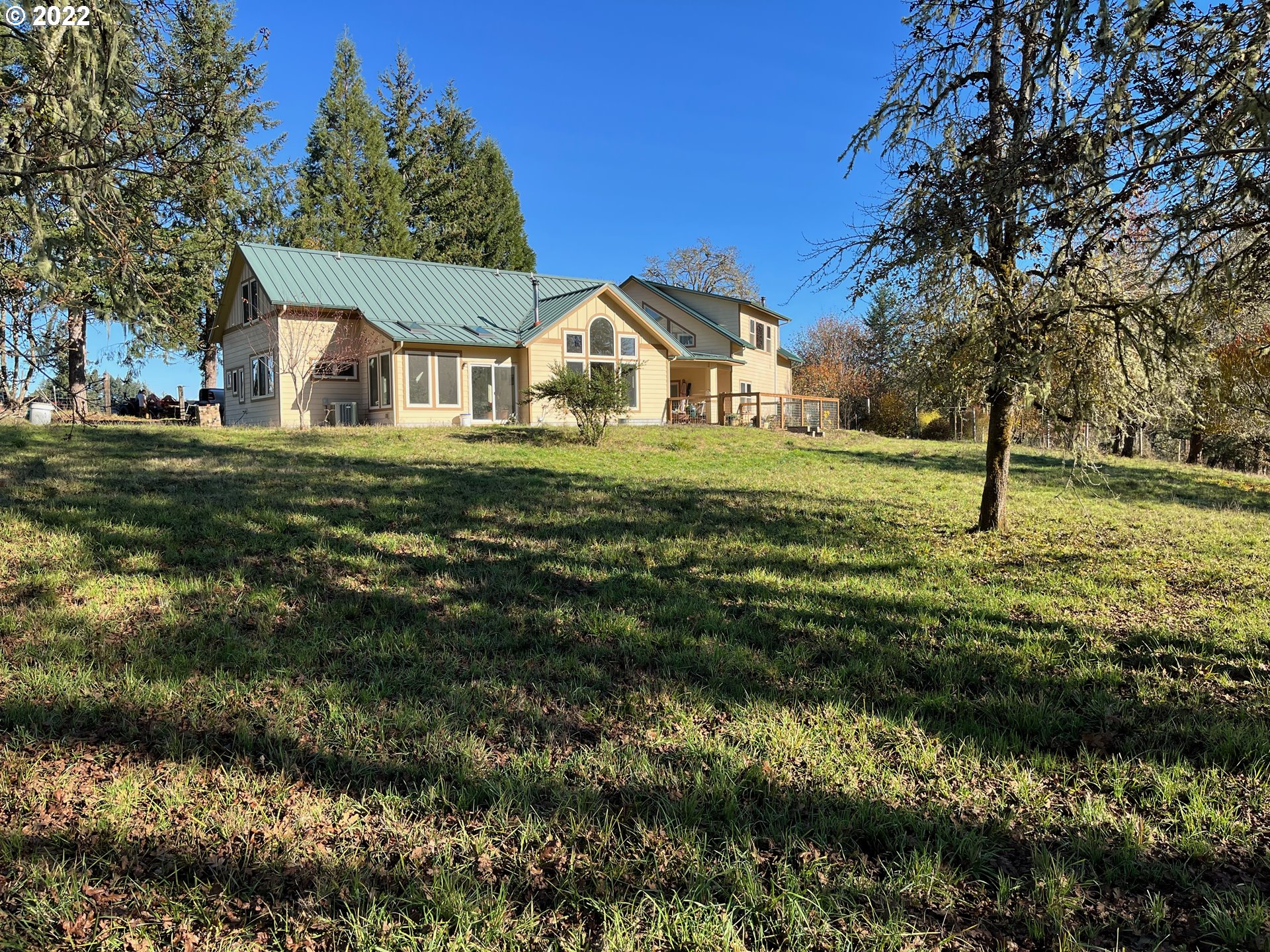 1138 Wells Road Elkton, OR 97436 - Photo 1 of 1 a front view of house with yard and green space