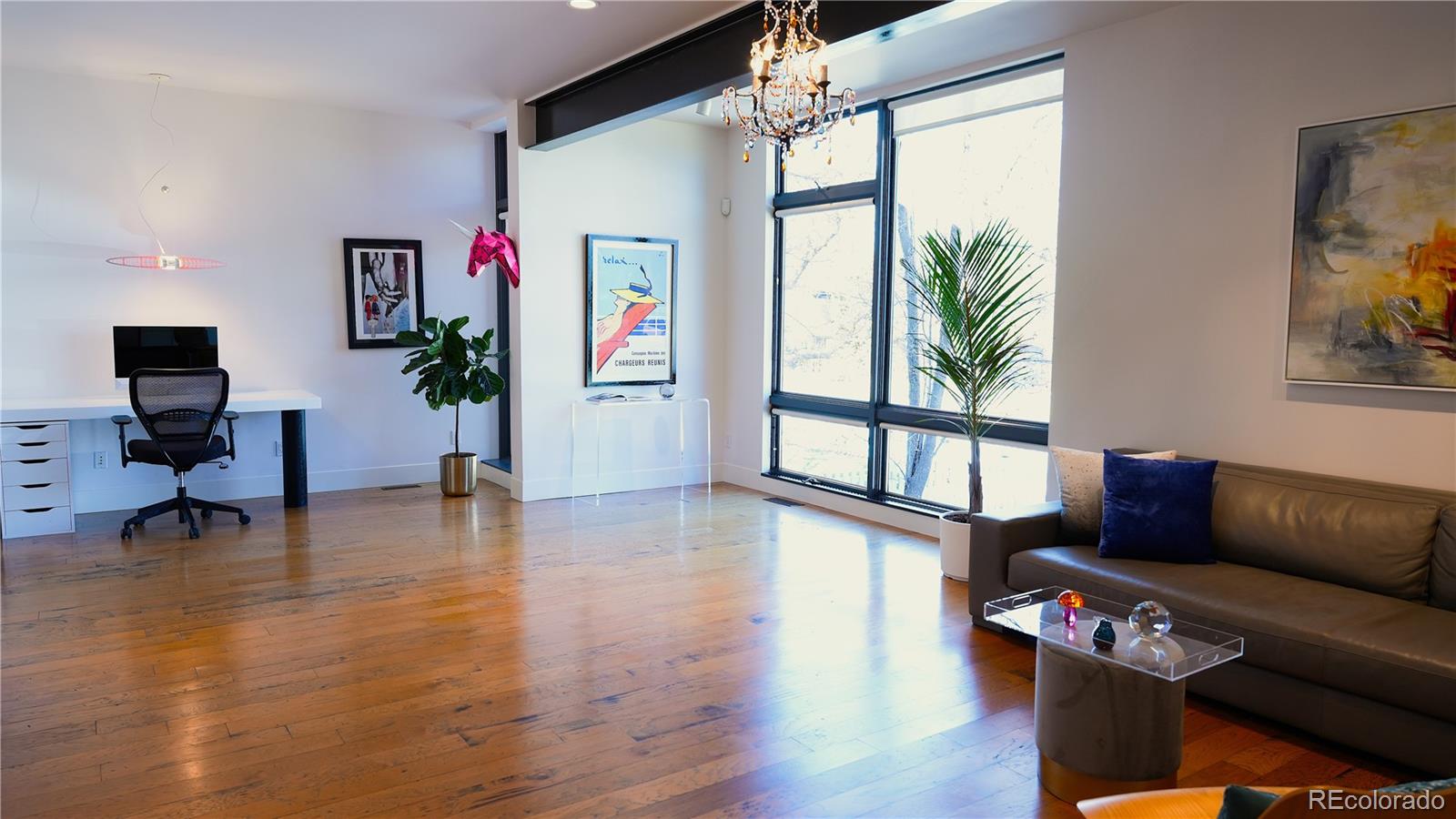 421 Dexter Street Denver, CO 80220 - Photo 11 of 36 a living room with furniture and a large window
