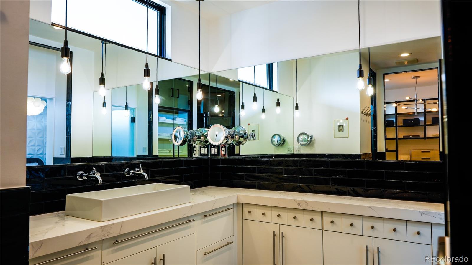 421 Dexter Street Denver, CO 80220 - Photo 17 of 36 a bathroom with a sink and a mirror