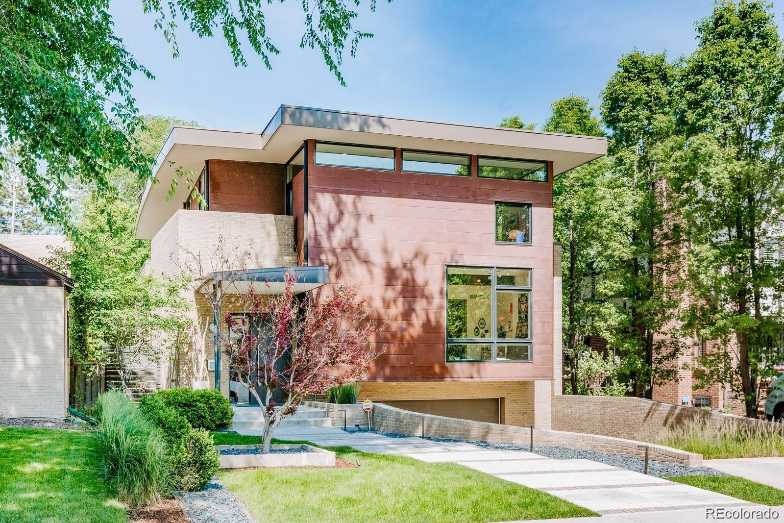 421 Dexter Street Denver, CO 80220 - Photo 2 of 36 a front view of a house with garden