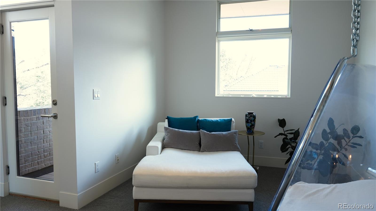 421 Dexter Street Denver, CO 80220 - Photo 22 of 36 a bedroom with a bed and a window