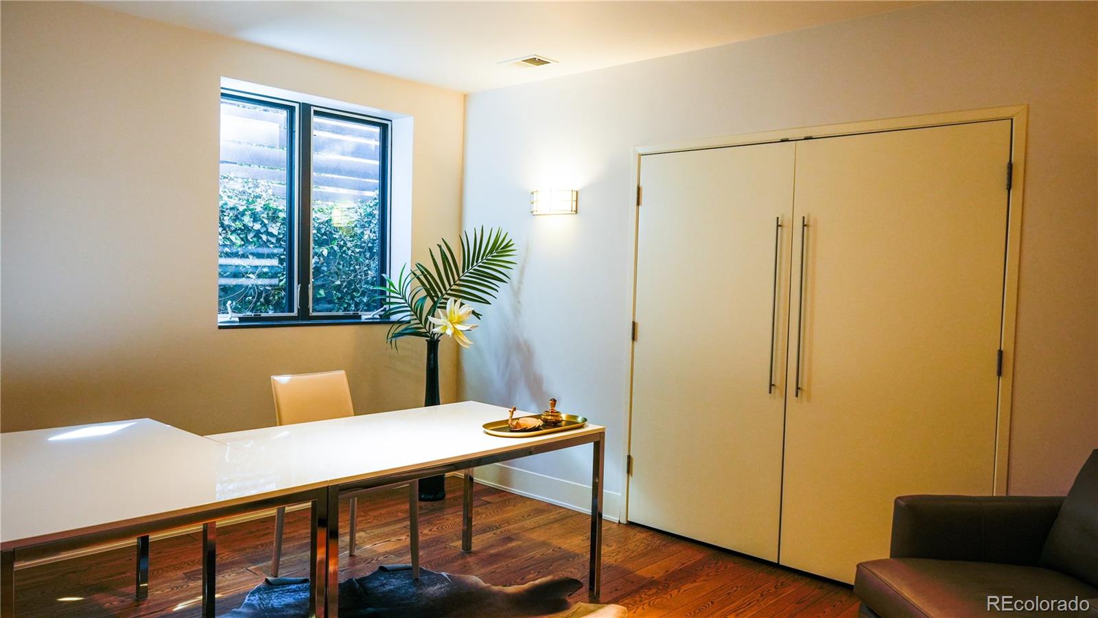 421 Dexter Street Denver, CO 80220 - Photo 30 of 36 a view of a room with a table and chairs