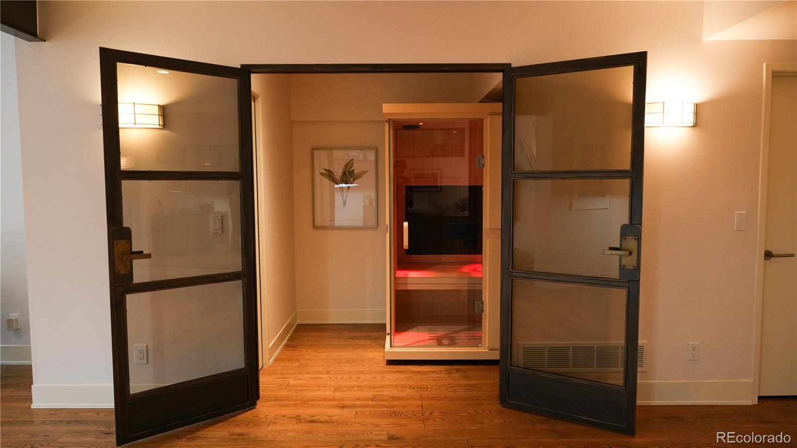 421 Dexter Street Denver, CO 80220 - Photo 31 of 36 an empty room with wooden floor and closet