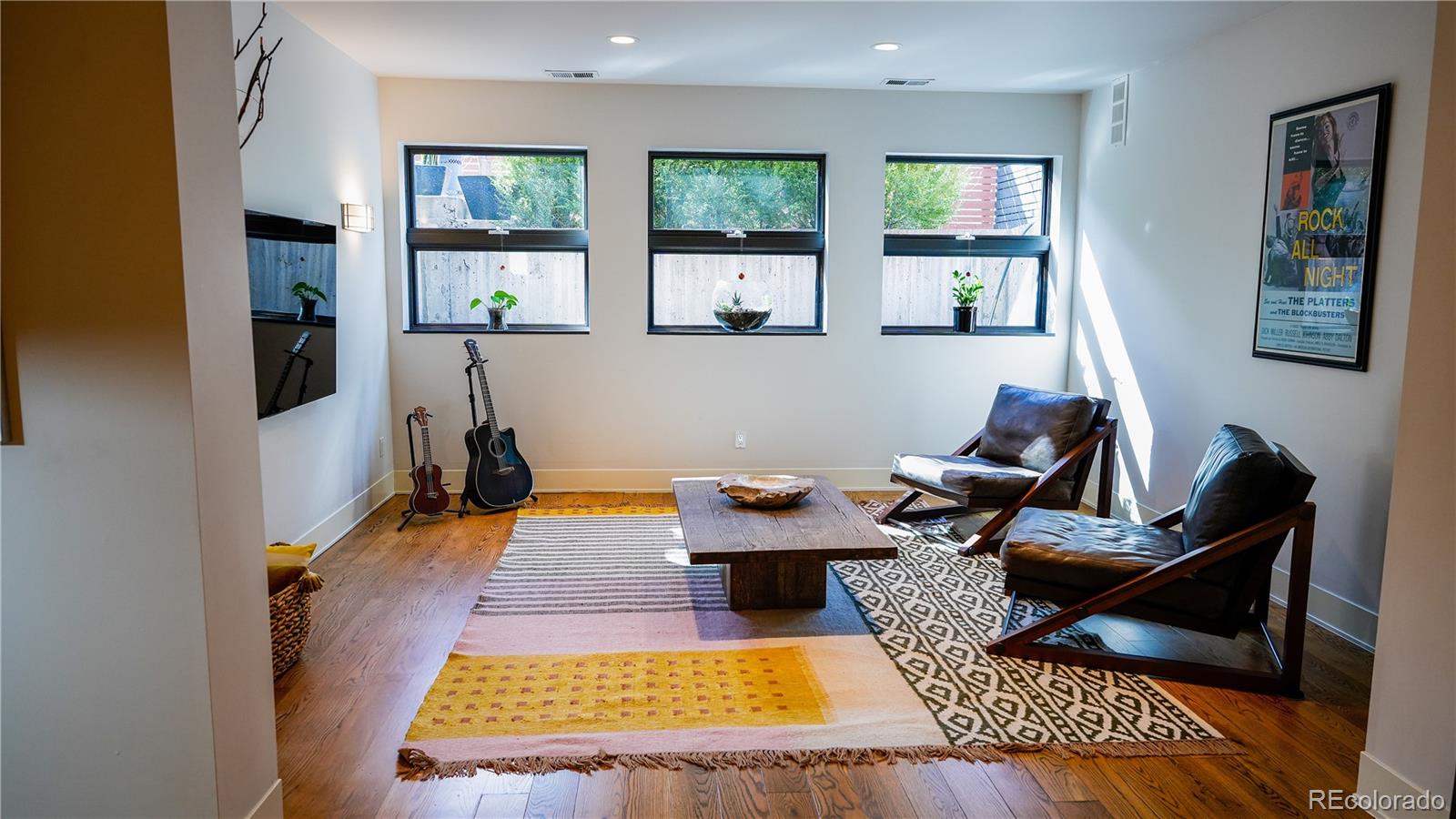 421 Dexter Street Denver, CO 80220 - Photo 32 of 36 a living room with furniture rug and window