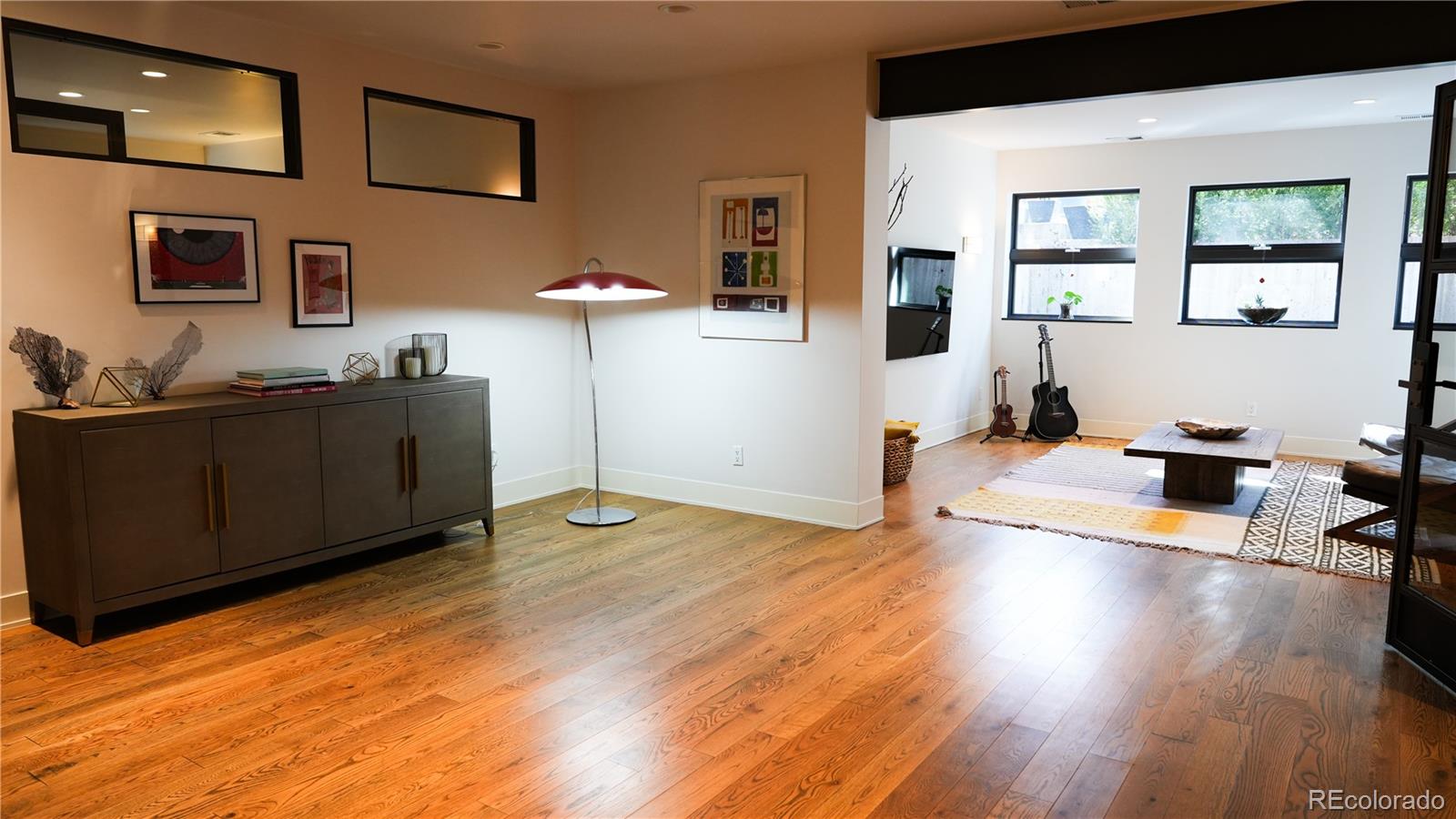 421 Dexter Street Denver, CO 80220 - Photo 33 of 36 a view of a workspace with furniture and wooden floor