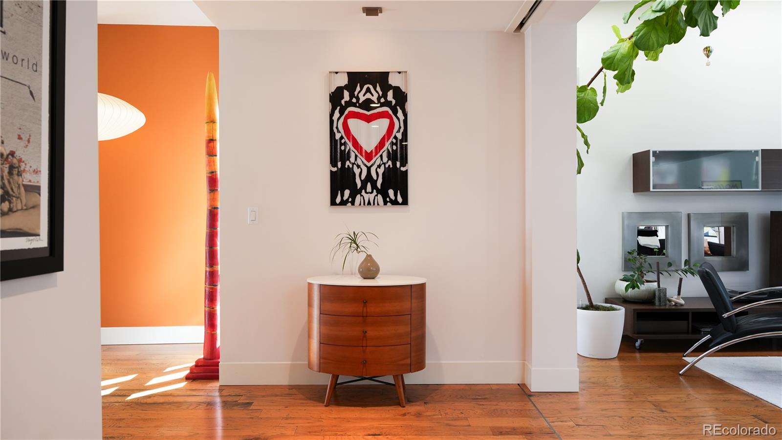 421 Dexter Street Denver, CO 80220 - Photo 4 of 36 a living room with furniture and a flat screen tv
