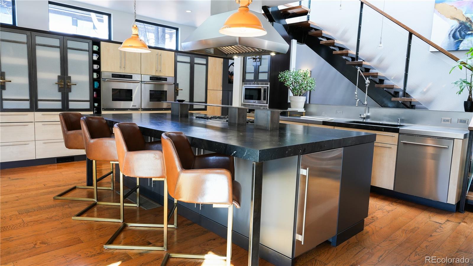 421 Dexter Street Denver, CO 80220 - Photo 7 of 36 a dinning table with chairs and wooden floor