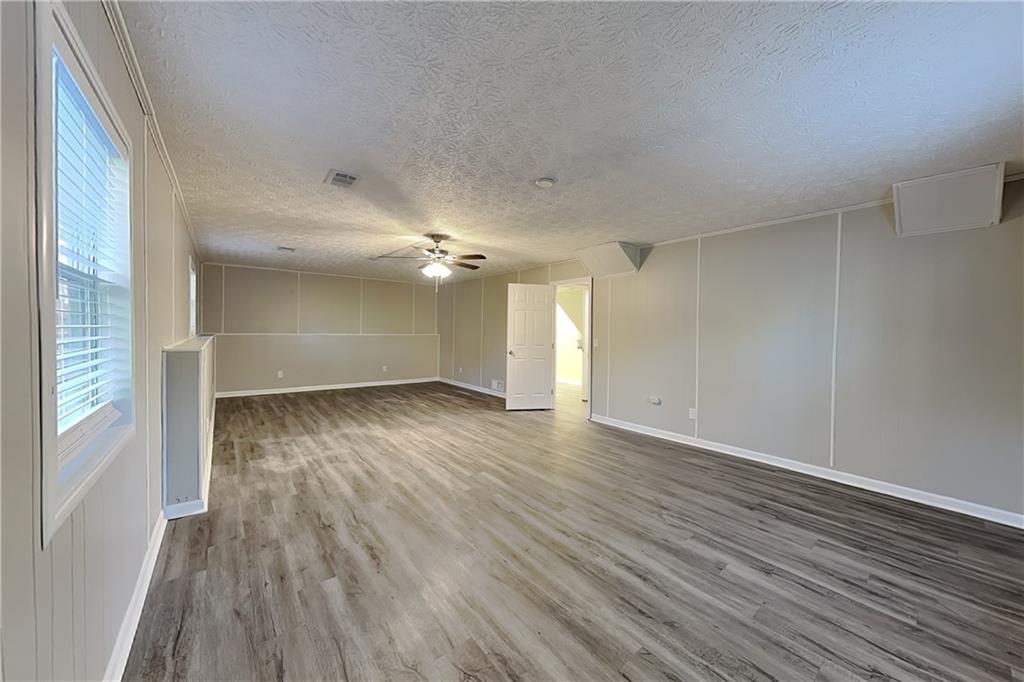 2021 Kramer Way Marietta, GA 30062 - Photo 5 of 21 wooden floor in an empty room with a window