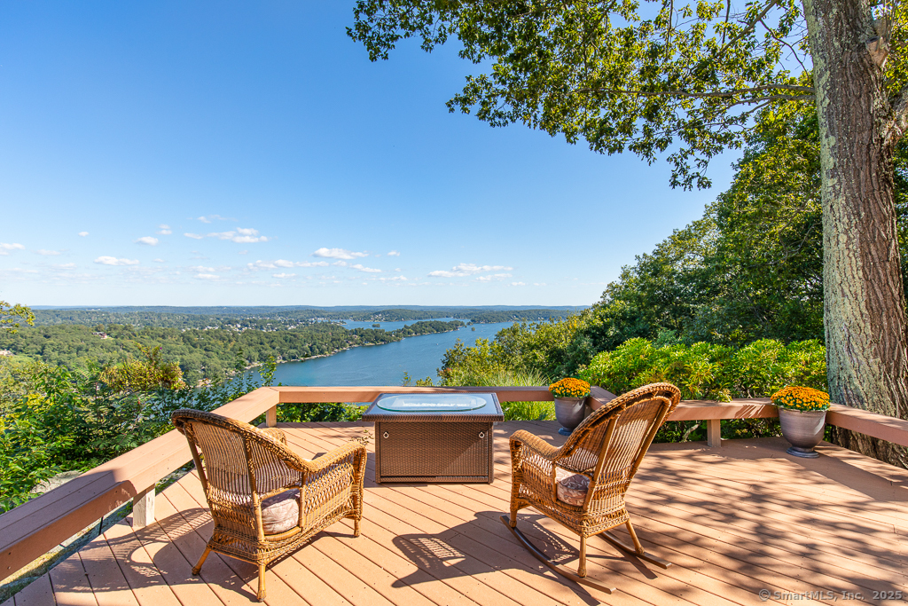 an outdoor sitting area with furniture and garden