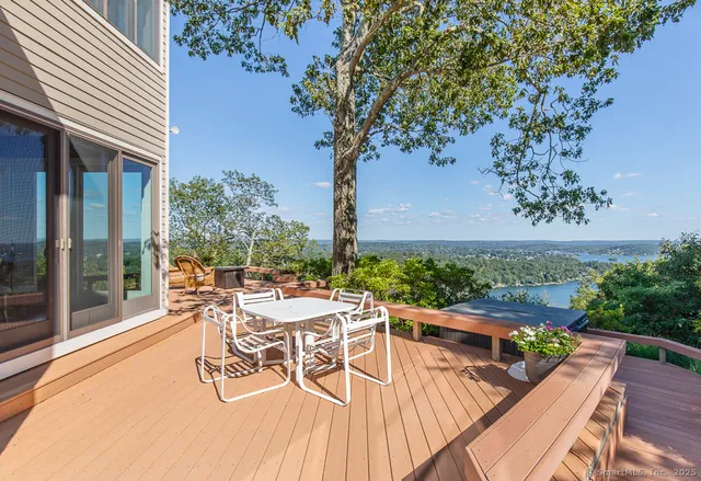 a view of a patio with swimming pool and sitting area