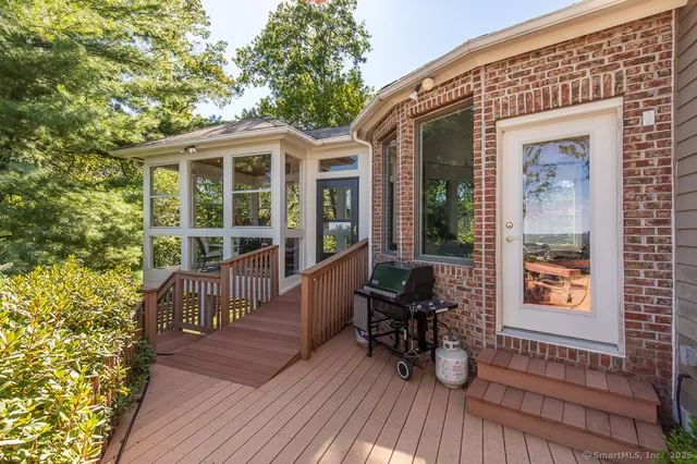 a view of a house with sitting area and wooden floor