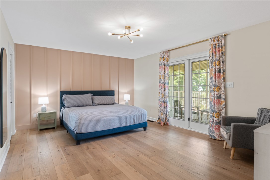 622 Jackson Road Anderson, SC 29626 - Photo 5 of 50 Hardwood flooring extends throughout this naturally illuminated bedroom, opening to a private outdoor deck.