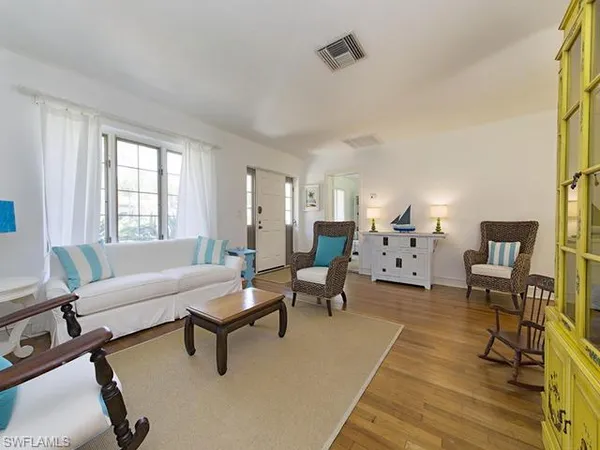 a living room with furniture and a table