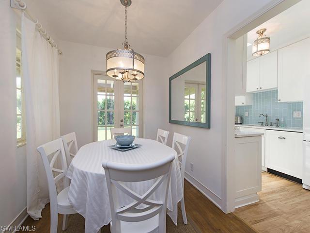 116 3rd Street North Naples, FL 34102 - Photo 5 of 8 a dining room with furniture and window