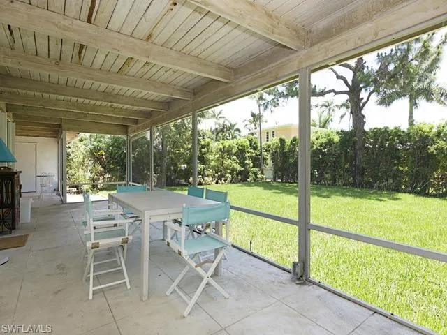 a view of a patio with a backyard