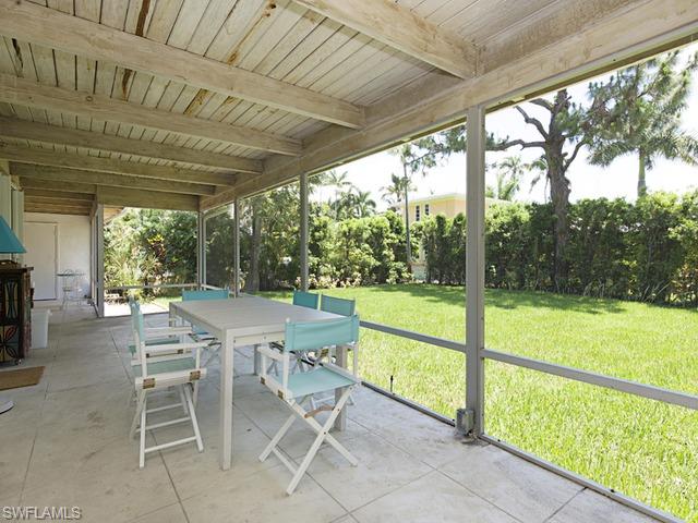 116 3rd Street North Naples, FL 34102 - Photo 8 of 8 a view of a patio with a backyard