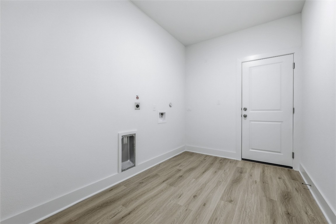 20308 Boggy Ford Road Lago Vista, TX 78645 - Photo 23 of 25 wooden floor in an empty room