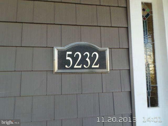 5232 Tramore Road Baltimore, MD 21214 - Photo 2 of 20 a close up of a street sign