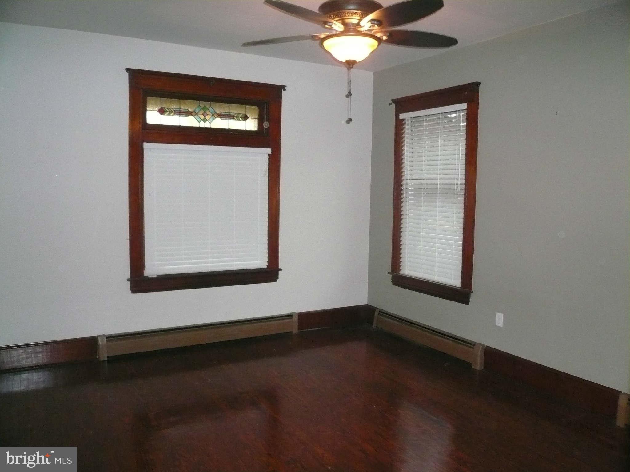 5232 Tramore Road Baltimore, MD 21214 - Photo 4 of 20 an empty room with a window